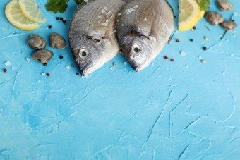 high-angle-fish-with-lemon-copy-space